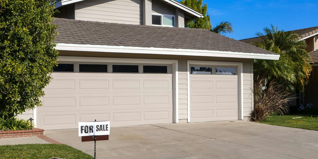 house for sale sign in Carlsbad neighborhood