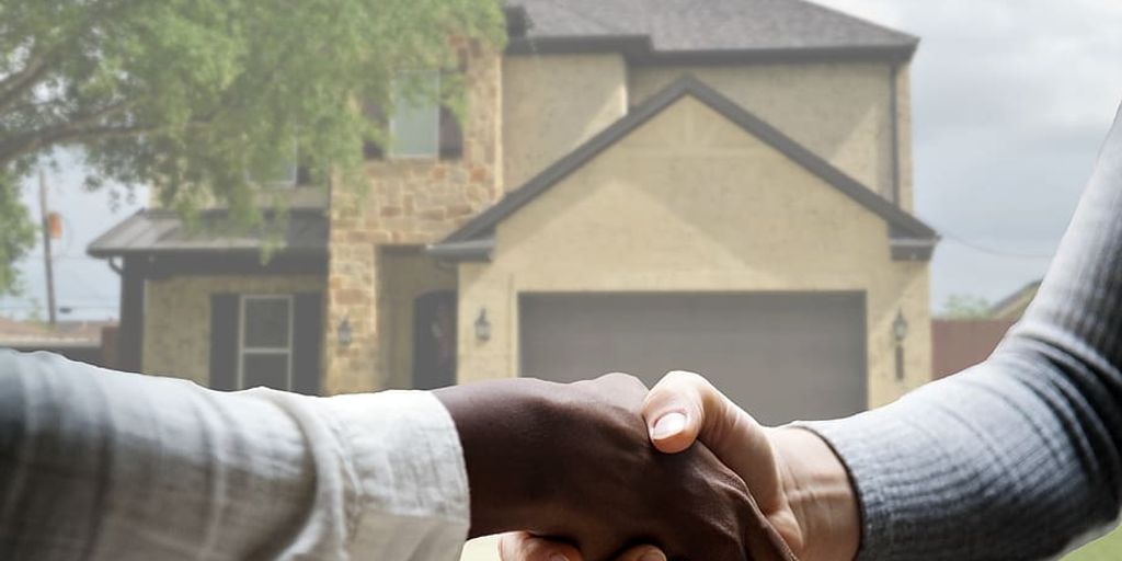 happy family selling house to real estate agent in Brawley