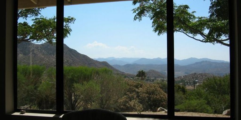 house for sale sign in Morongo Valley desert landscape