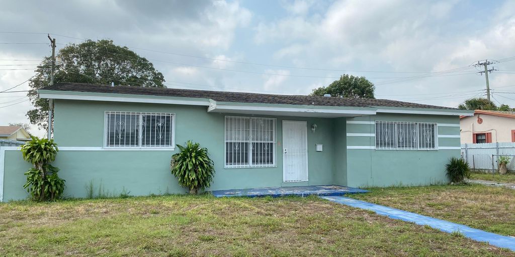 house for sale sign in Bell Gardens