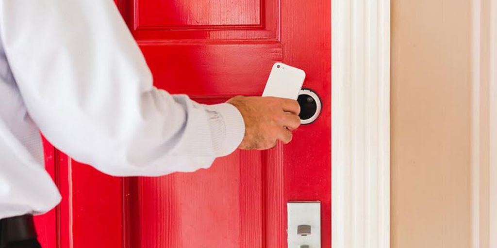 real estate agent handing keys to new homeowners in Chino Hills