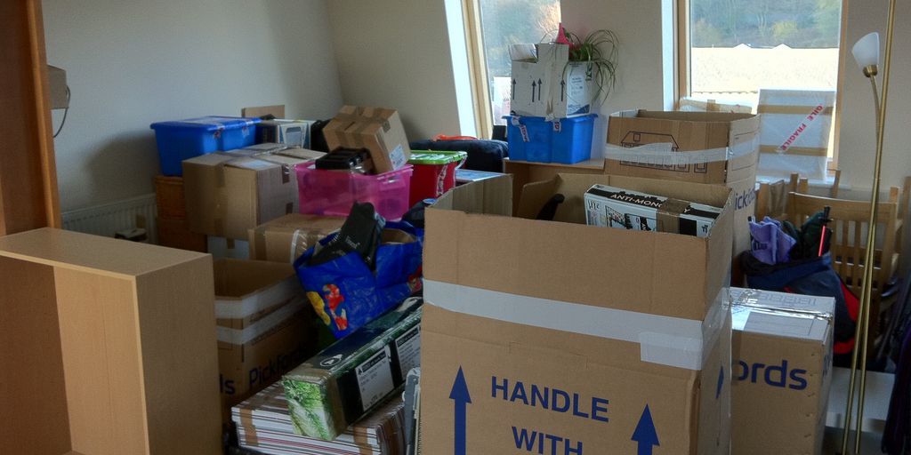 family packing boxes in a house in Hemet