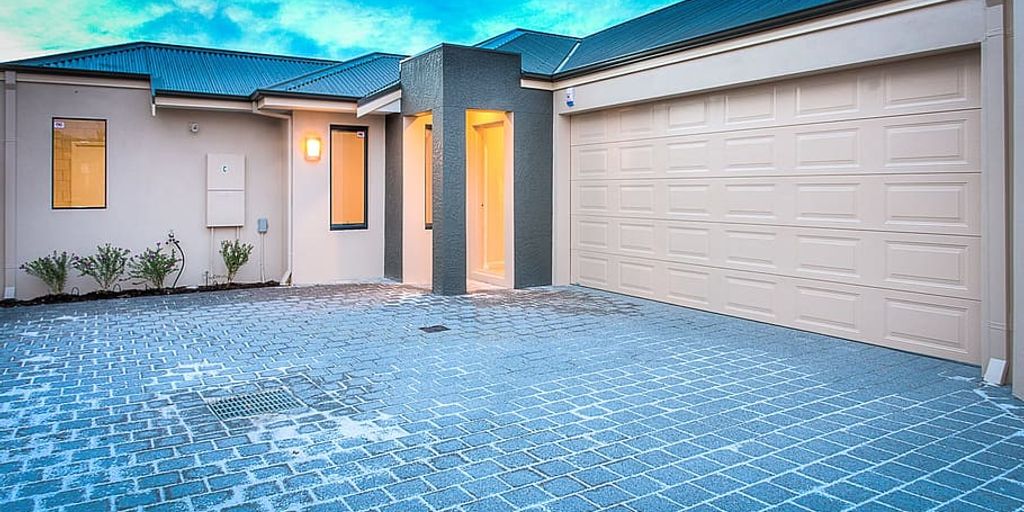 real estate agent showing house to couple in South Gate