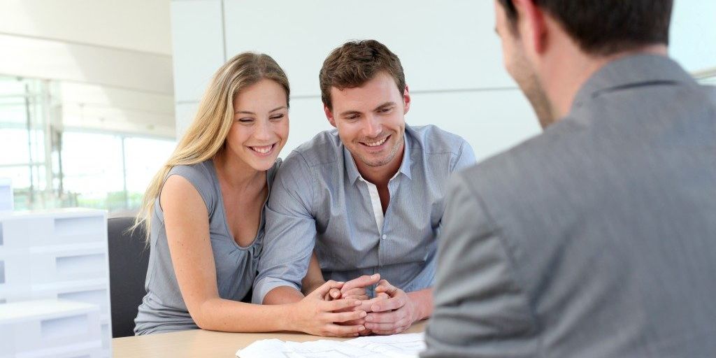 happy family selling house to real estate agent in Hawaiian Gardens