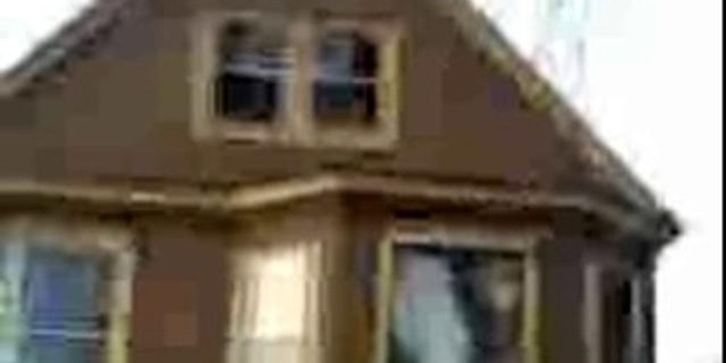 happy family in front of a sold house in La Mirada